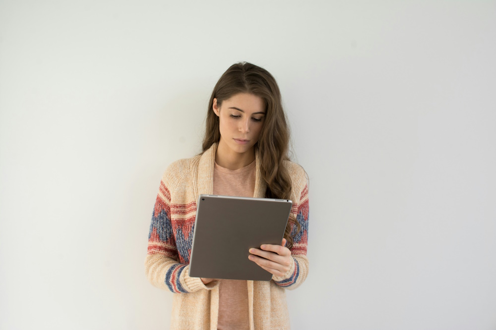 woman looking at a tablet